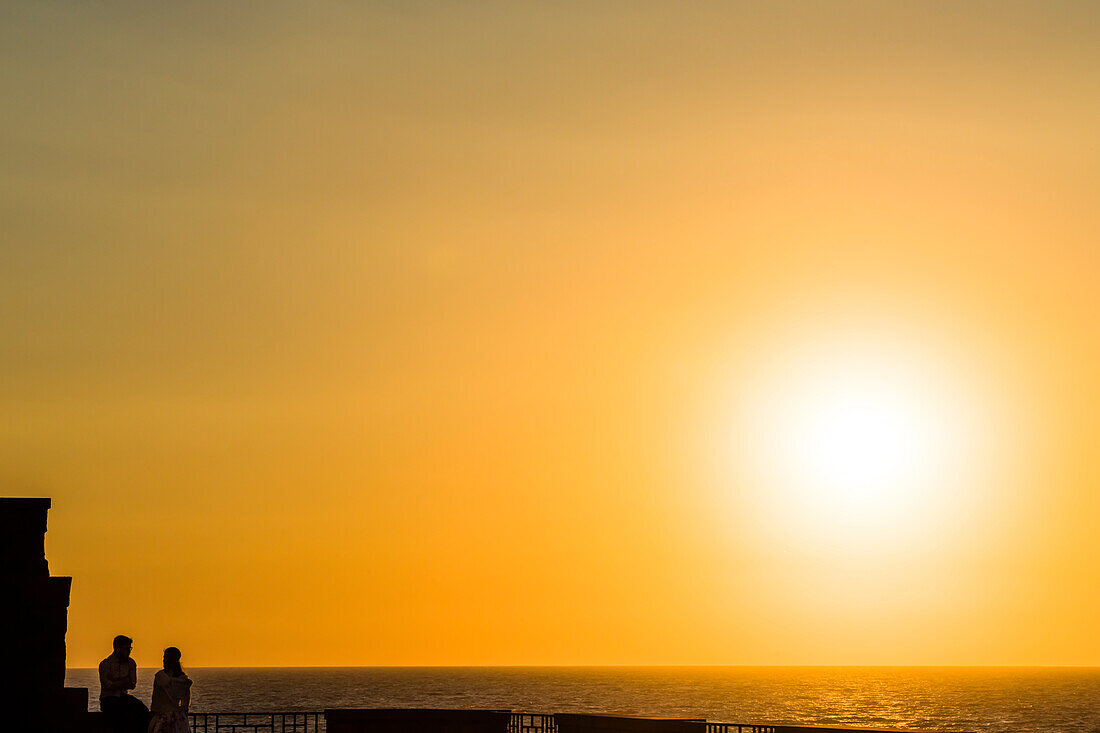 A couple in the sunset, Forio, Ischia, the Gulf of Naples, Campania, Italy