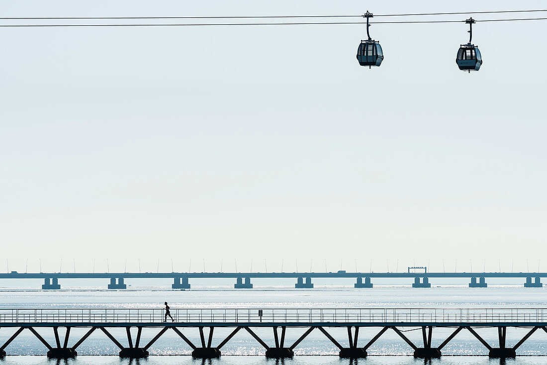 The cable railway Teleférico do Parque das Nações in the Parque das Nações in front the scenery of the river Tajo, Lisbon, Portugal