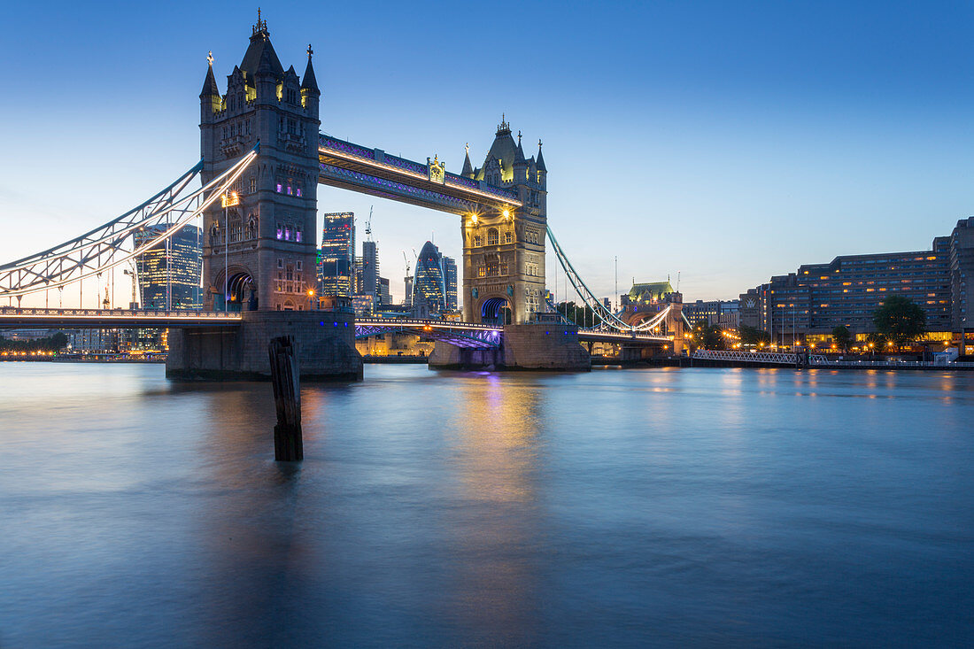 Tower Bridge and City of London skyline from Butler's Wharf at dusk, London, England, United Kingdom, Europe