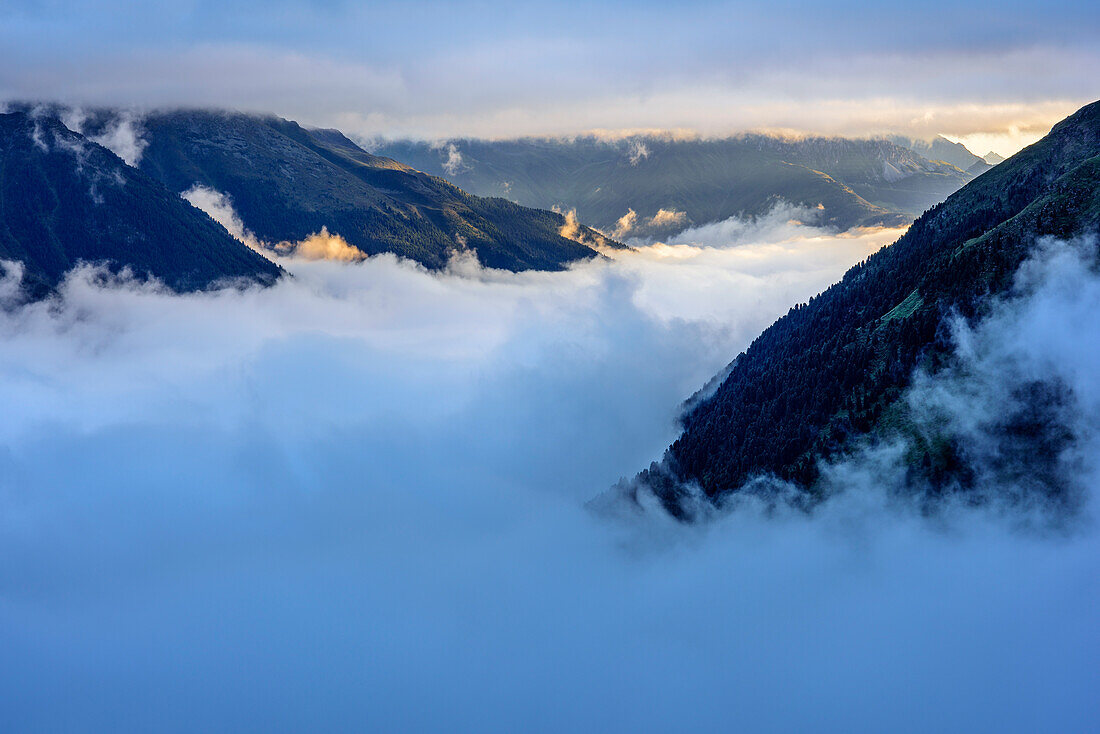 Fog above valley Unterbergtal, Wilder Freiger, Stubai Alps, Tyrol, Austria