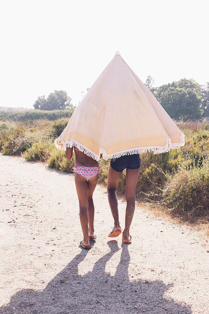 Sisters walking to the beach