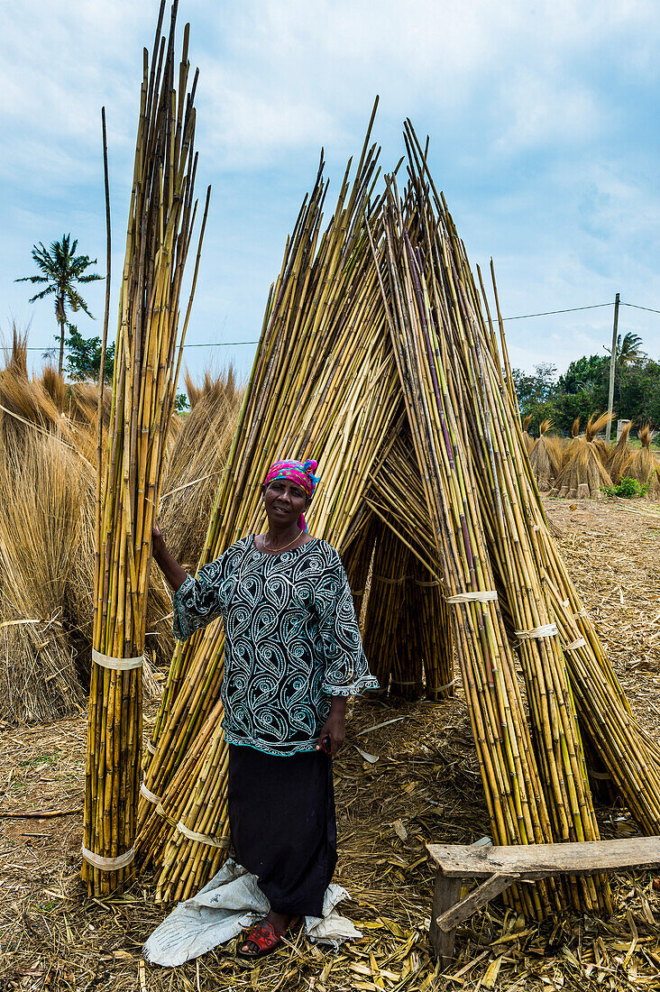 Friendly woman sells reeds on the shores of Lake Tanganyika, Bujumbura, Burundi, Africa