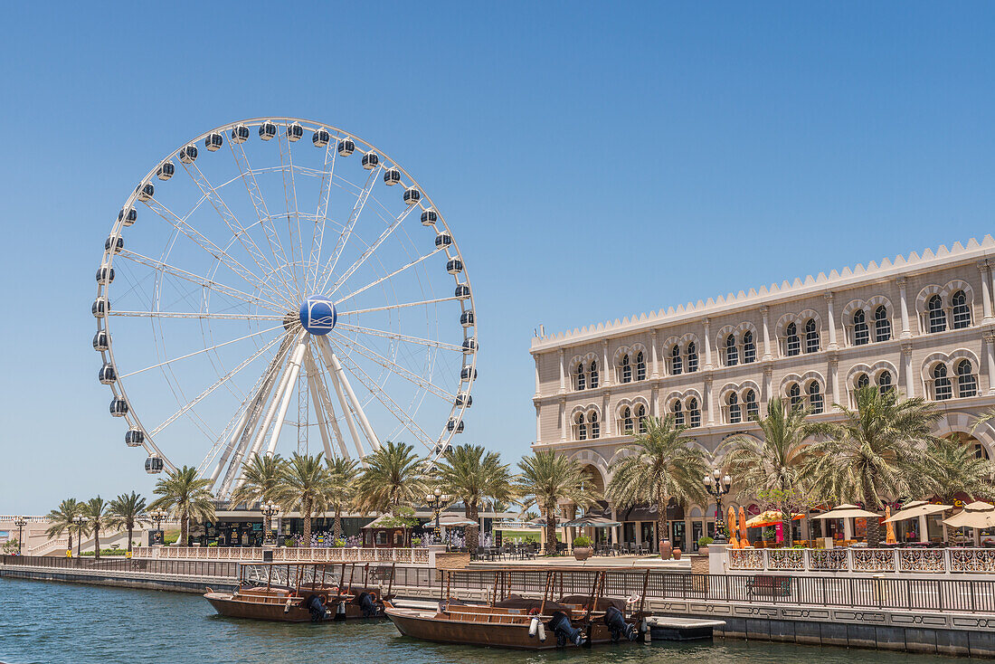 Eye of the Emirates and cafes in Sharjah, United Arab Emirates, Middle East