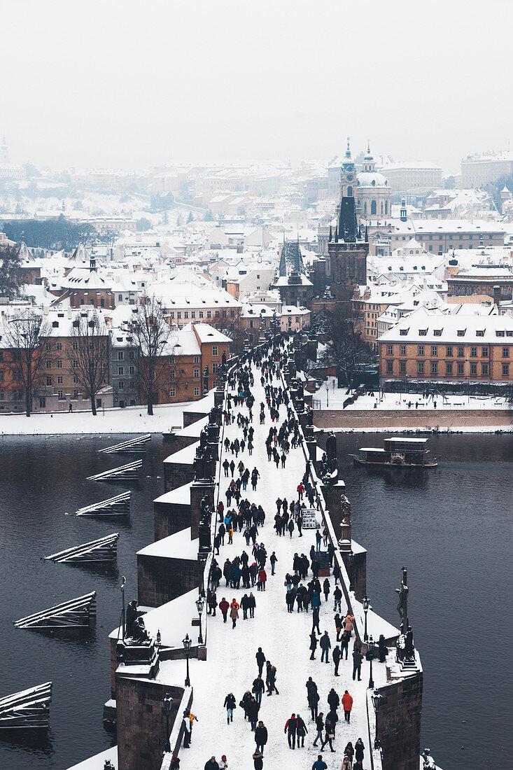 Charles Bridge over the Vltava River in winter, UNESCO World Heritage Site, Prague, Czech Republic, Europe