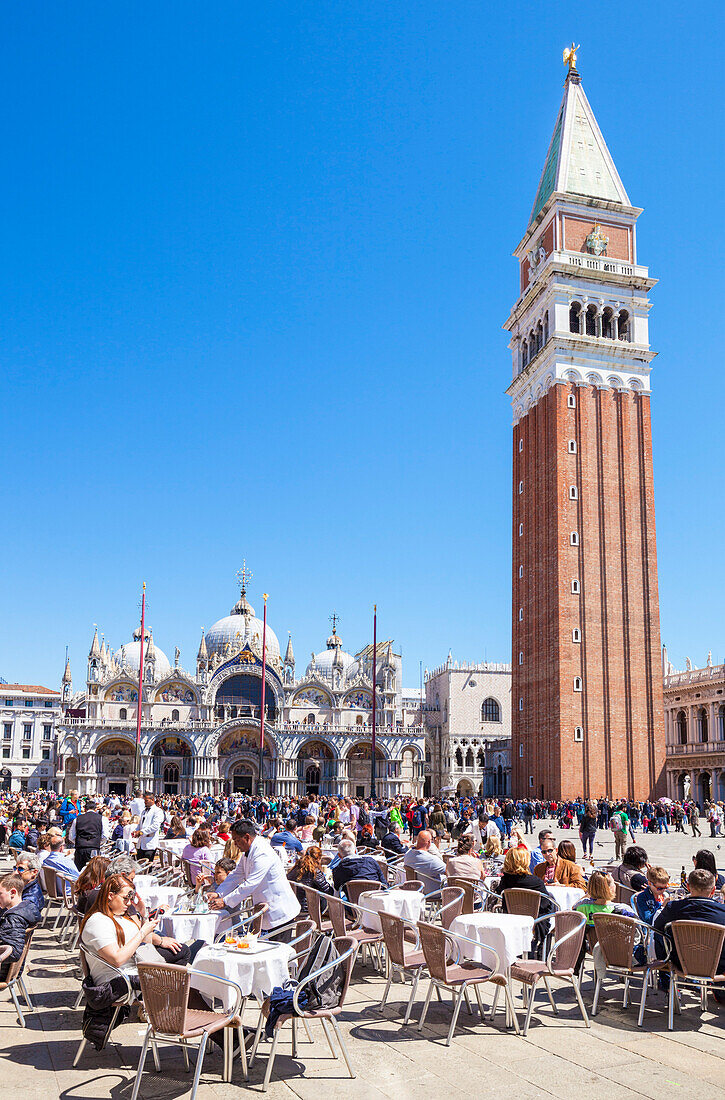 Campanile, Basilica di San Marco, Piazza San Marco, tourists and the cafes of St. Marks Square, Venice, UNESCO World Heritage Site, Veneto, Italy, Europe