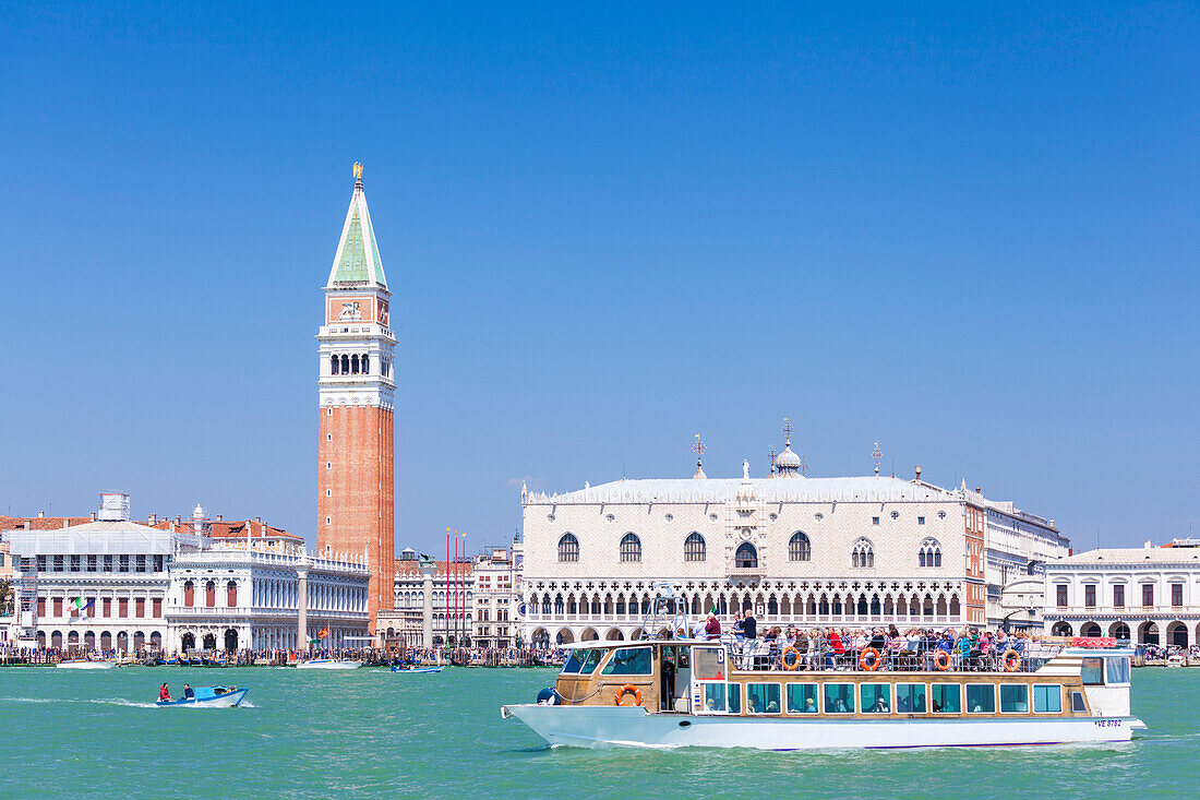 Campanile tower, Palazzo Ducale (Doges Palace), Bacino di San Marco (St. Marks Basin) and water taxis, Venice, UNESCO World Heritage Site, Veneto, Italy, Europe