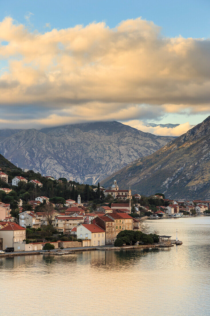 Town on the shores of the stunningly beautiful Bay of Kotor (Boka Kotorska) at sunset, UNESCO World Heritage Site, Montenegro, Europe