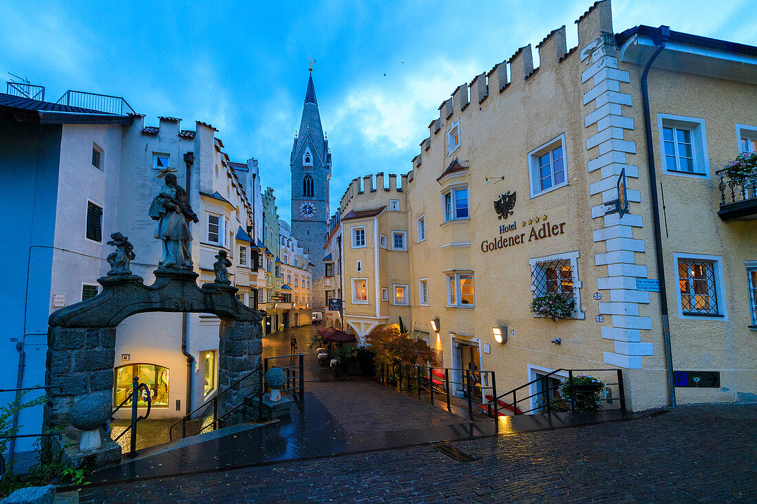 The Goldener Adler Hotel and the bell tower of Cathedral of Brixen (Bressanone), province of Bolzano, South Tyrol, Italy, Europe