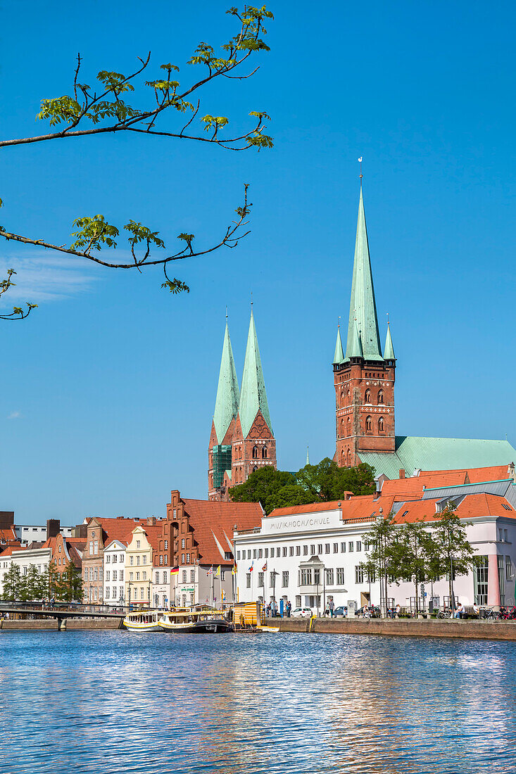 View over river Trave towards old town, St. Marien and St. Petri church, Luebeck, Baltic coast, Schleswig-Holstein, Germany