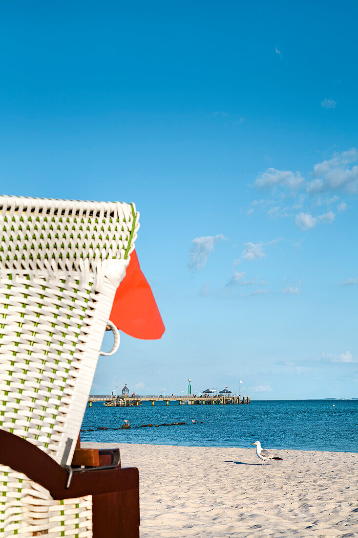 Beach with beach chair and pier, Grömitz, Baltic coast, Schleswig-Holstein, Germany