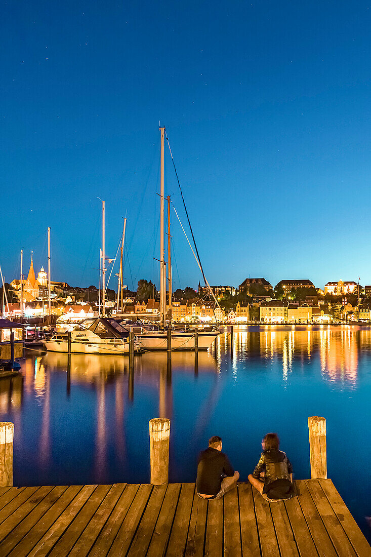 View over Flensburg fjord towards the illuminated city, Flensburg, Baltic coast, Schleswig-Holstein, Germany