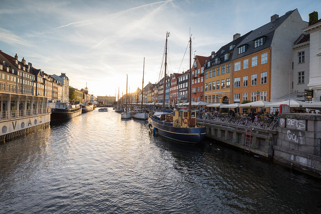 Colourful facades and typical boats along the canal and entertainment district of Nyhavn, Copenhagen, Denmark, Europe