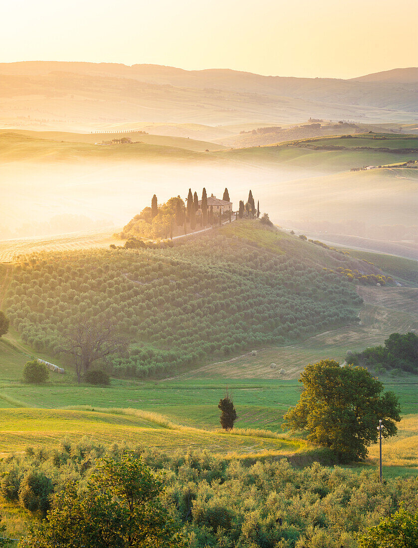 Podere Belvedere, the famous italian farmhouse, during sunrise, Val d'Orcia, Siena province, Tuscany, Italy