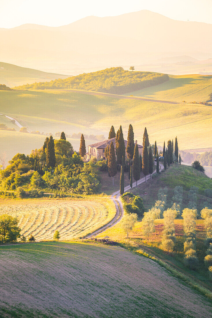 Podere Belvedere, the famous italian farmhouse, during sunrise, Val d'Orcia, Siena province, Tuscany, Italy