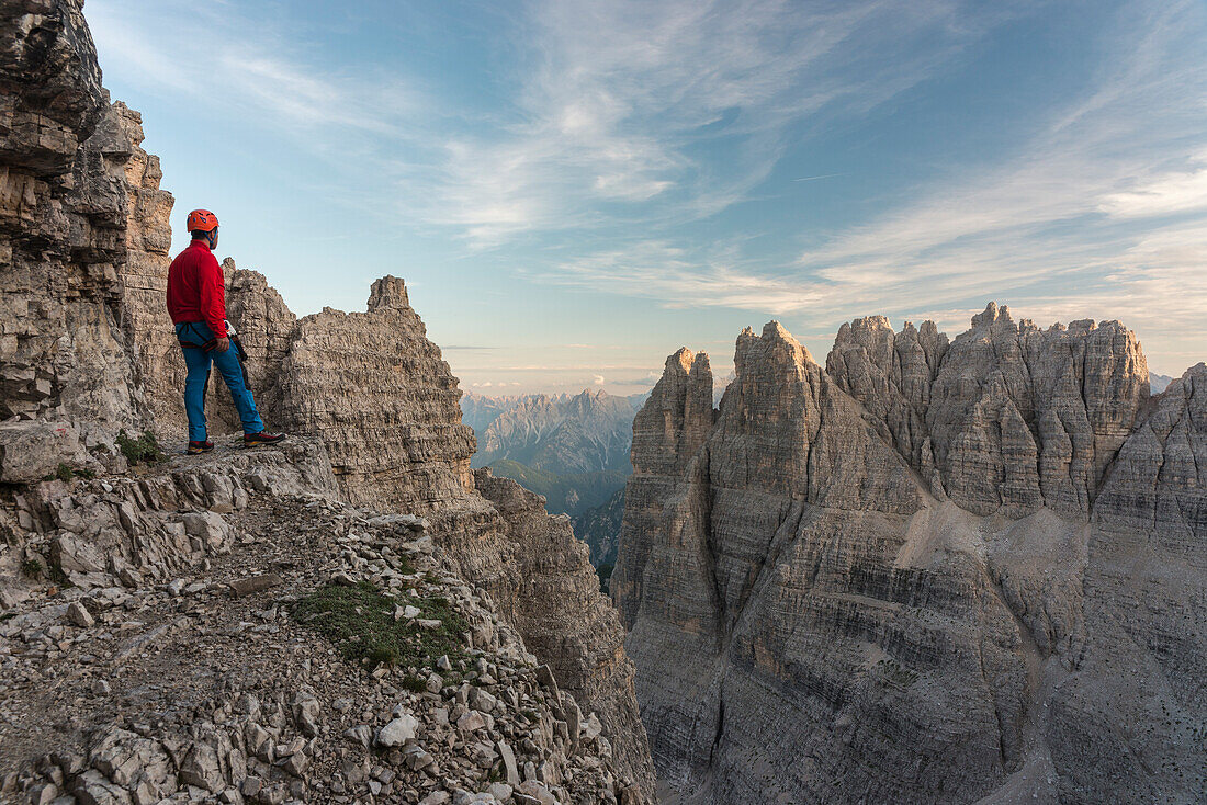 'Sesto/Sexten, Dolomites, South Tyrol, province of Bolzano, Italy, Climber on the via ferrata ''Path of Peace'' to the mountain of Monte Paterno'