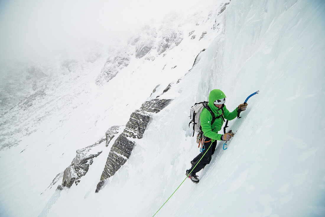 Ice climber leading up into the Open Book in Tuckerman Ravine on Mount Washington, New Hampshire.