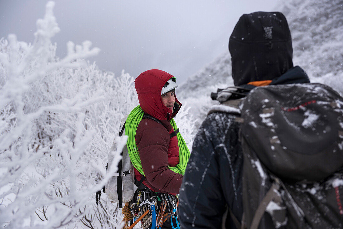 A client and guide walking out from a day of ice climbing.