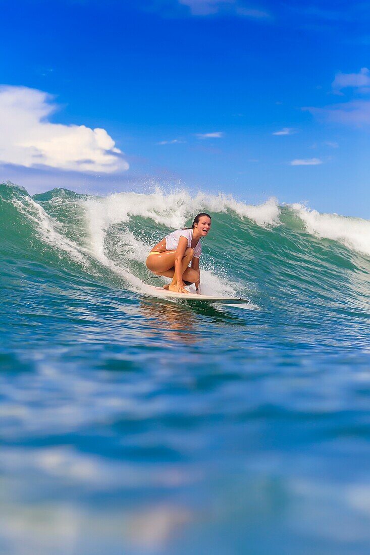 Young woman surfing