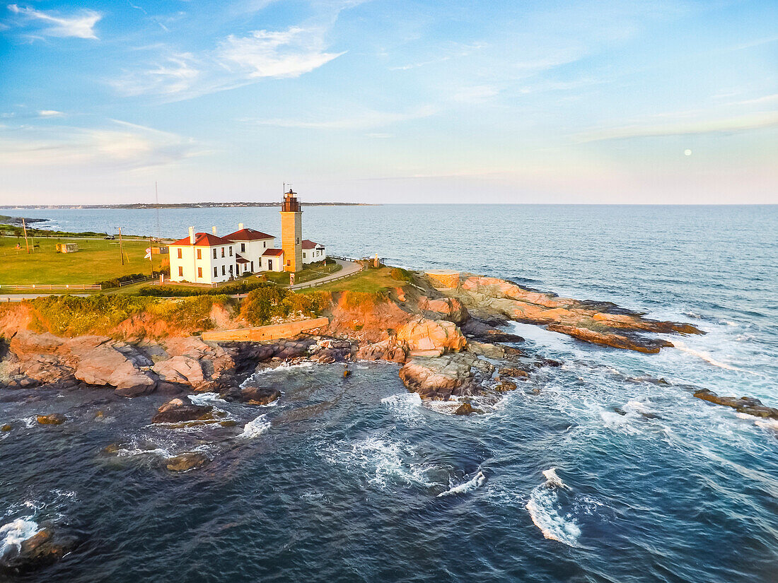 Aerial view of Beavertail Lighthouse in Jamestown, RI, during moonrise