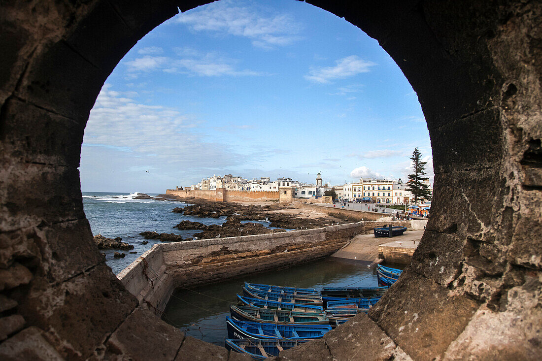 A view of Essaouira, Morocco from a porthole in one of the stone bastions surrounding the city.