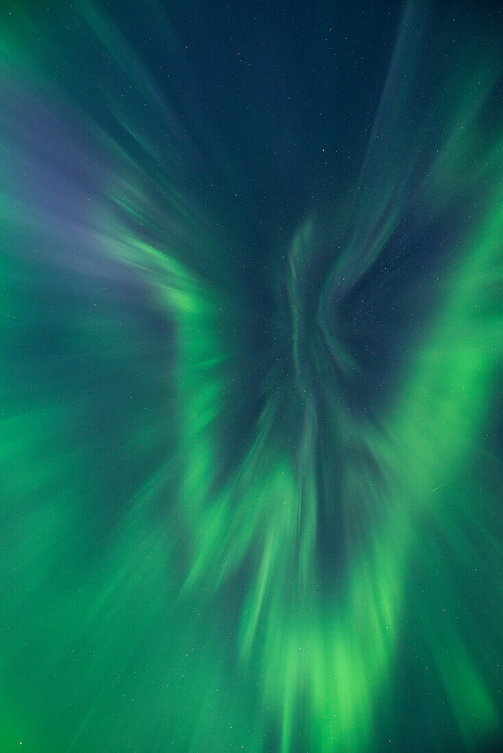 Aurora corona fills sky over Lofoten Islands, Norway