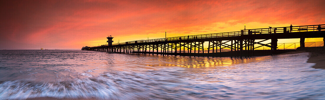 Long exposure panorama of waves and pier at seal Beach, Orange County, California, USA