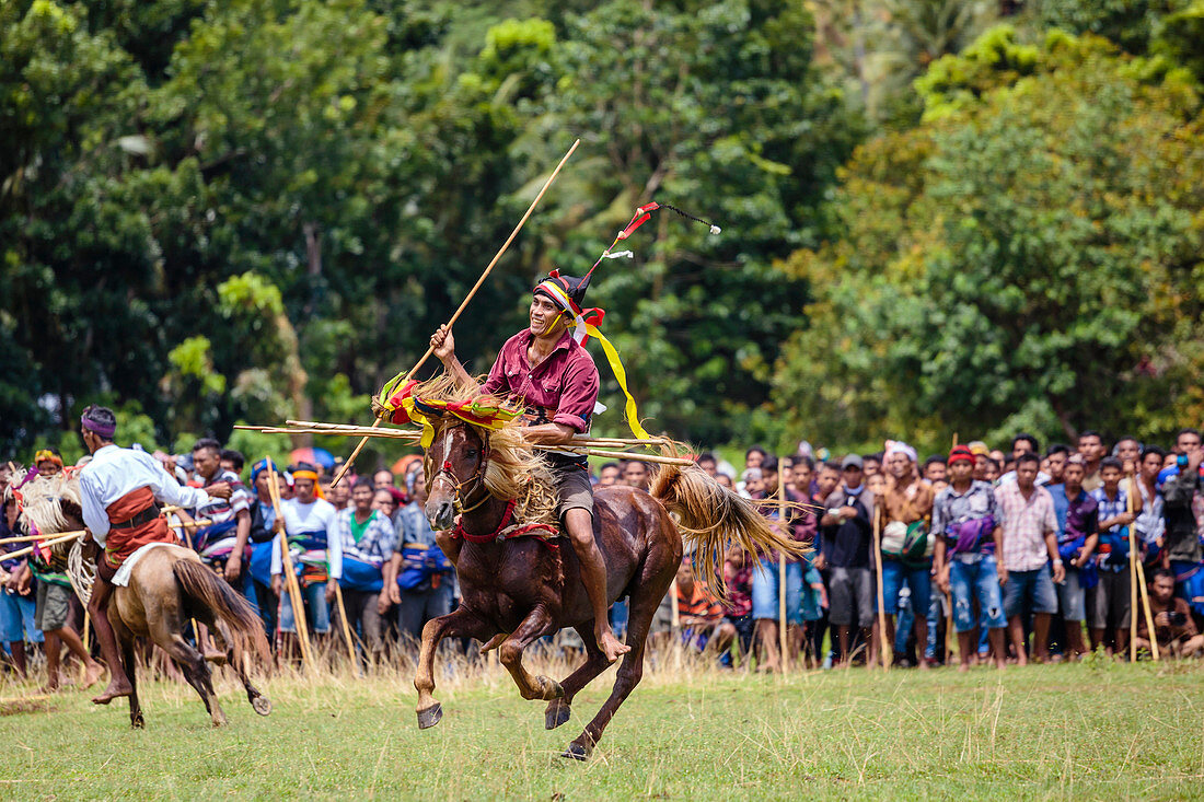 Men on horses competing in Pasola Festival, Sumba island, Indonesia