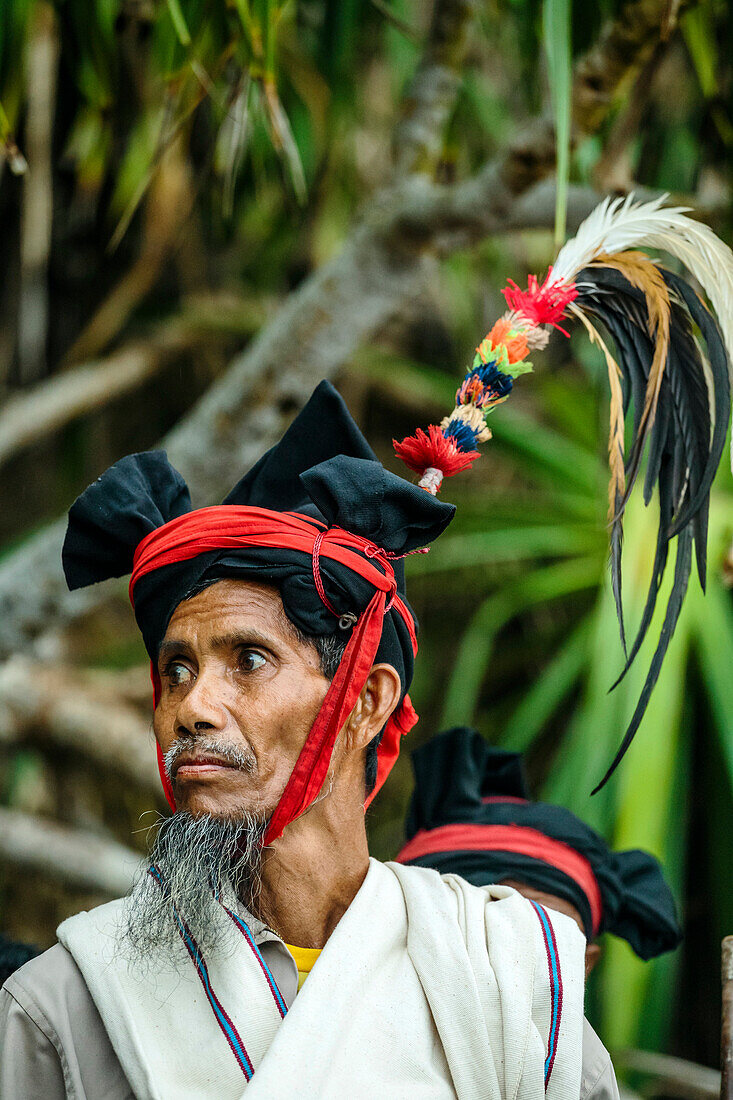 Portrait of mature man in traditional costume, Pasola festival, Sumba Island, Indonesia