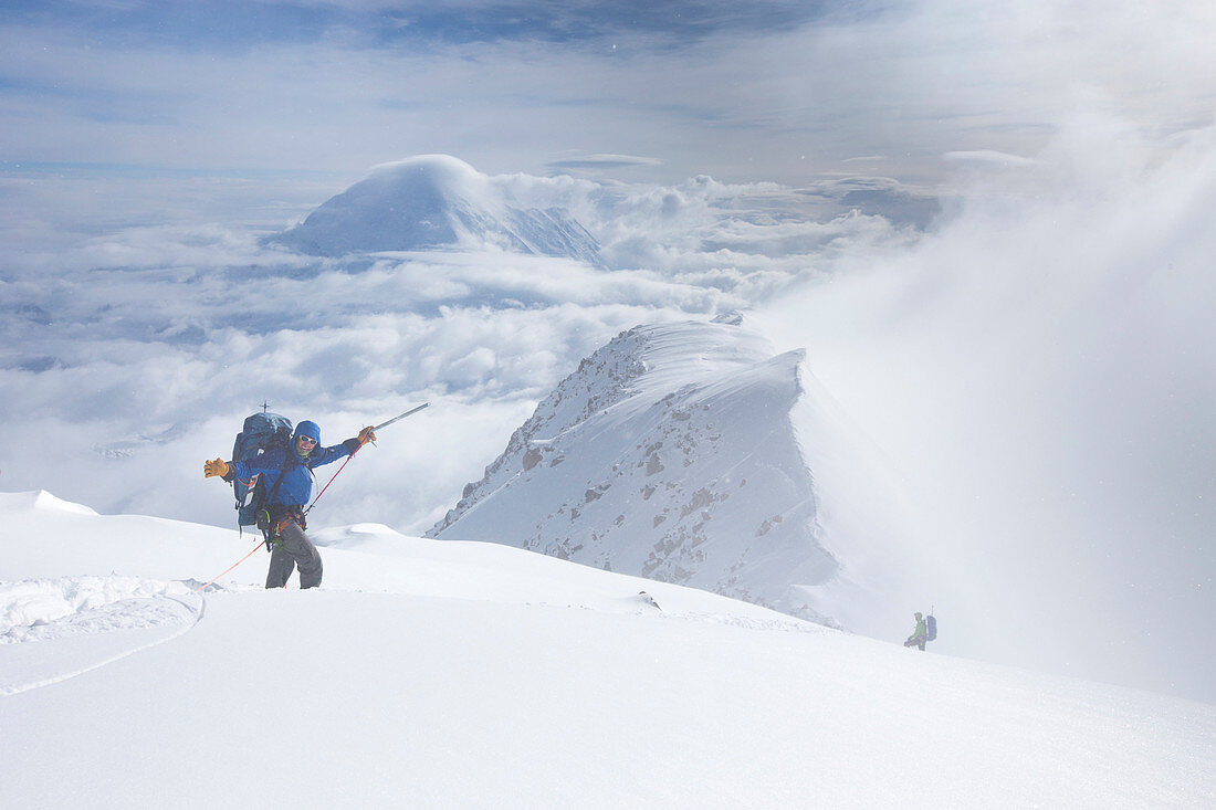 Mountaineers are descending from Denali in Alaska, the highest peak of northern America. Clouds are coming in.