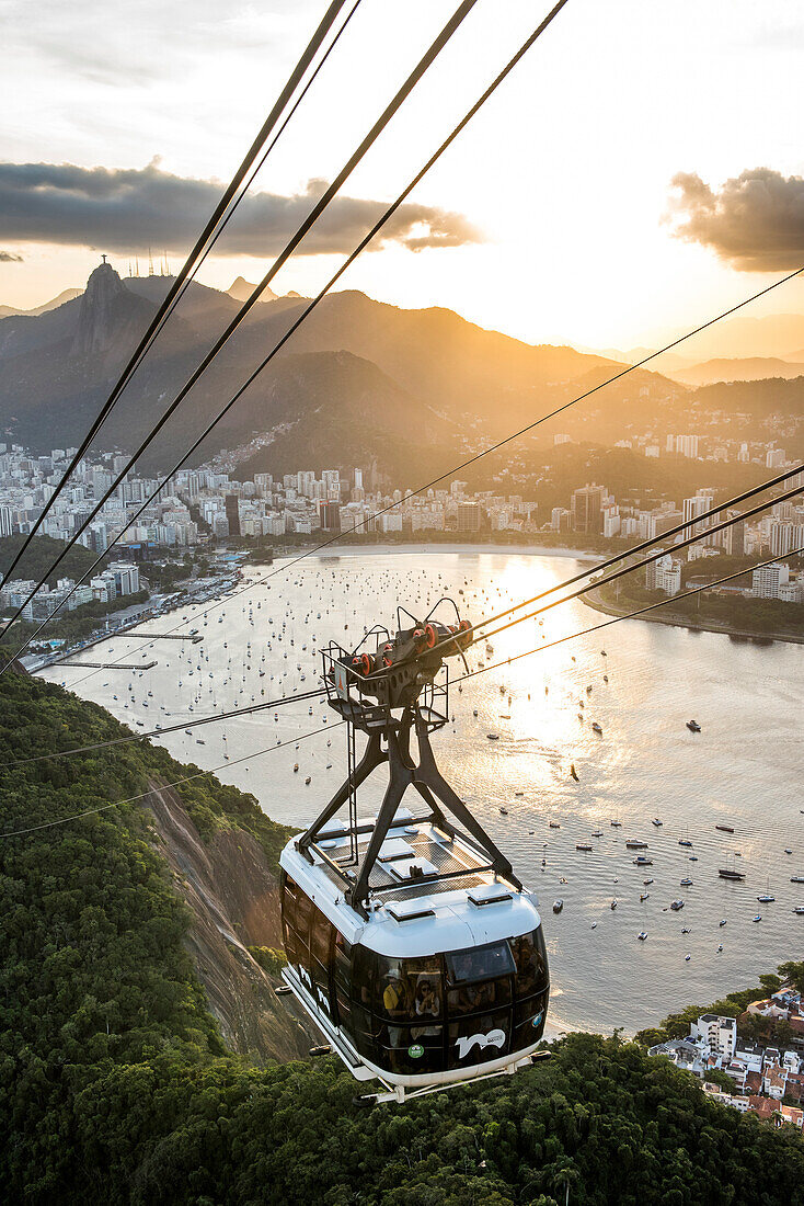 View of Sugar Loaf Mountain cable car with Botafogo Bay during sunset, Rio de Janeiro, Brazil