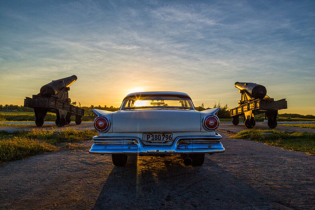 Ford Fairlane parked by canons of Castillo de Tres Reyes, Havana Cuba