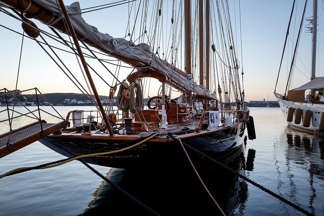 Moored vintage sailboat in the early morning. Port of Mahó, Minorca, Balearic Islands, Spain