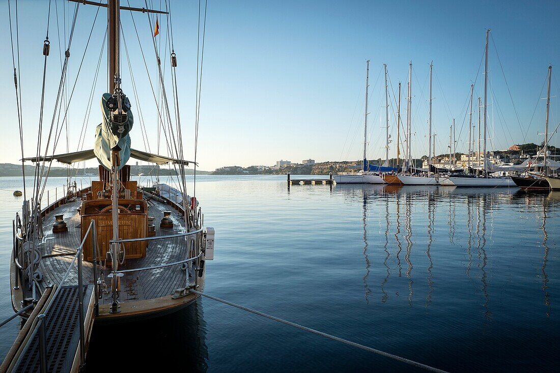 Moored vintage sailboat in the early morning. Port of Mahó, Minorca, Balearic Islands, Spain