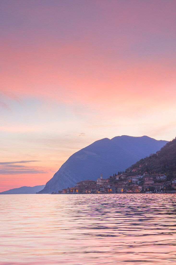 Sunset over Peschiera Maraglio in Iseo lake, Montisola, Iseo lake, Brescia province, Lombardy district, Italy