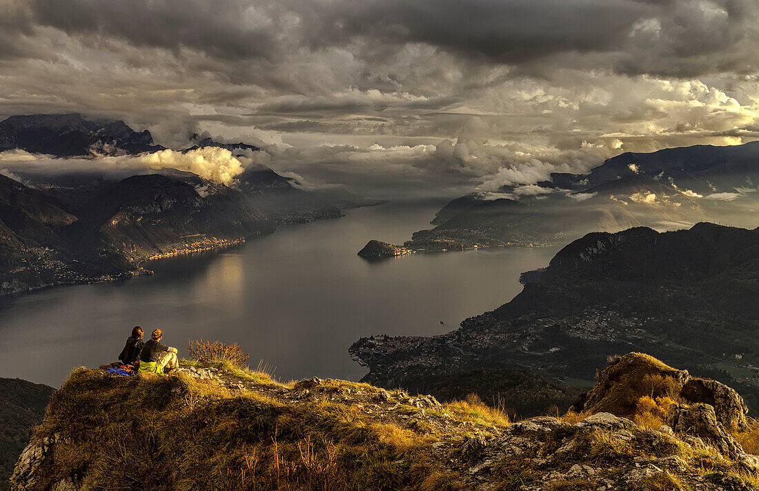 Two boys admiring the view of Lake Como from Mount Grona over Menaggio In background Menaggio,Bellagio,Varenna,Lombardy,Italy, europe