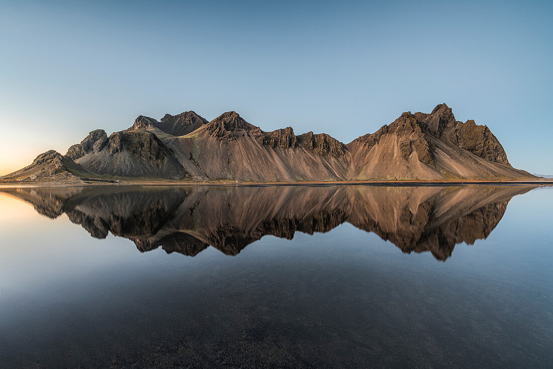 Stokksnes, Hofn, Eastern Iceland, Iceland, Vestrahorn mountain mirrors in the waters of the Stokksnes bay