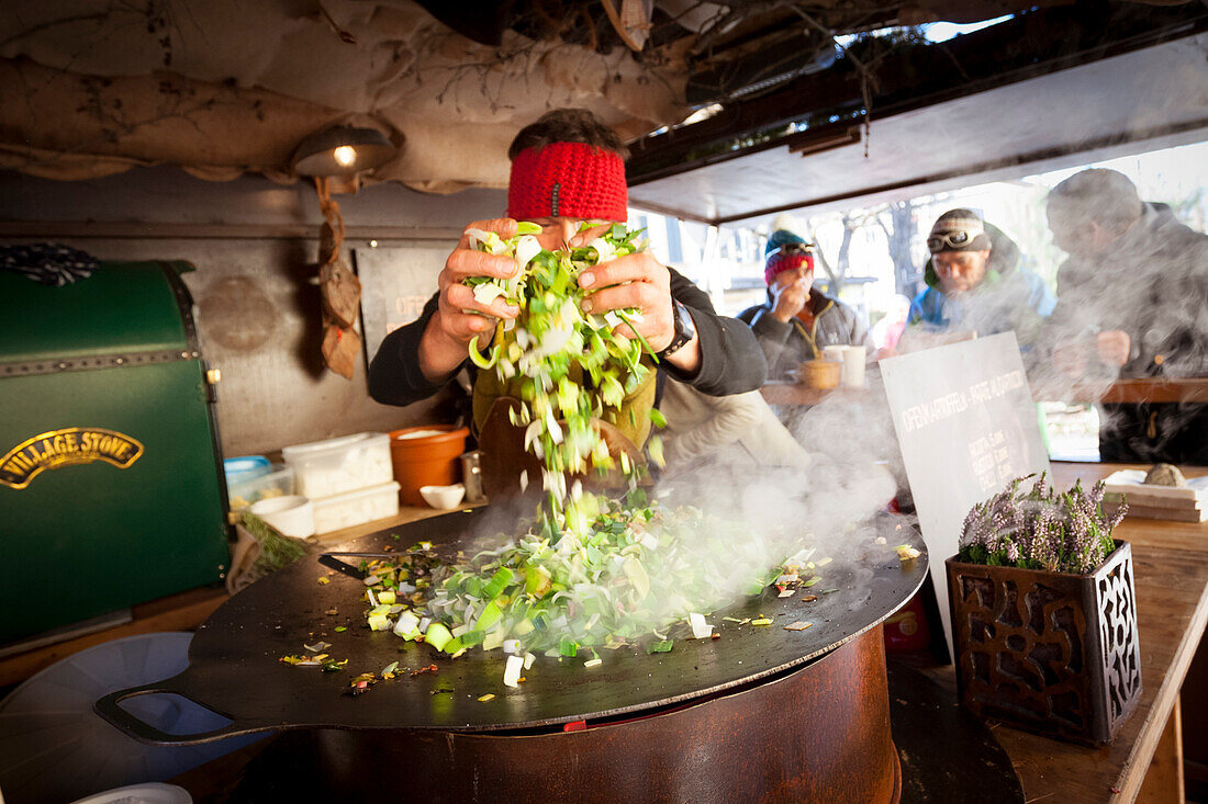 a snapshot taken during the preparation of a typical tyroler street food in the Christmas market, city of Bruneck, Bolzano province, South Tyrol, Trentino Alto Adige, Italy, Europe