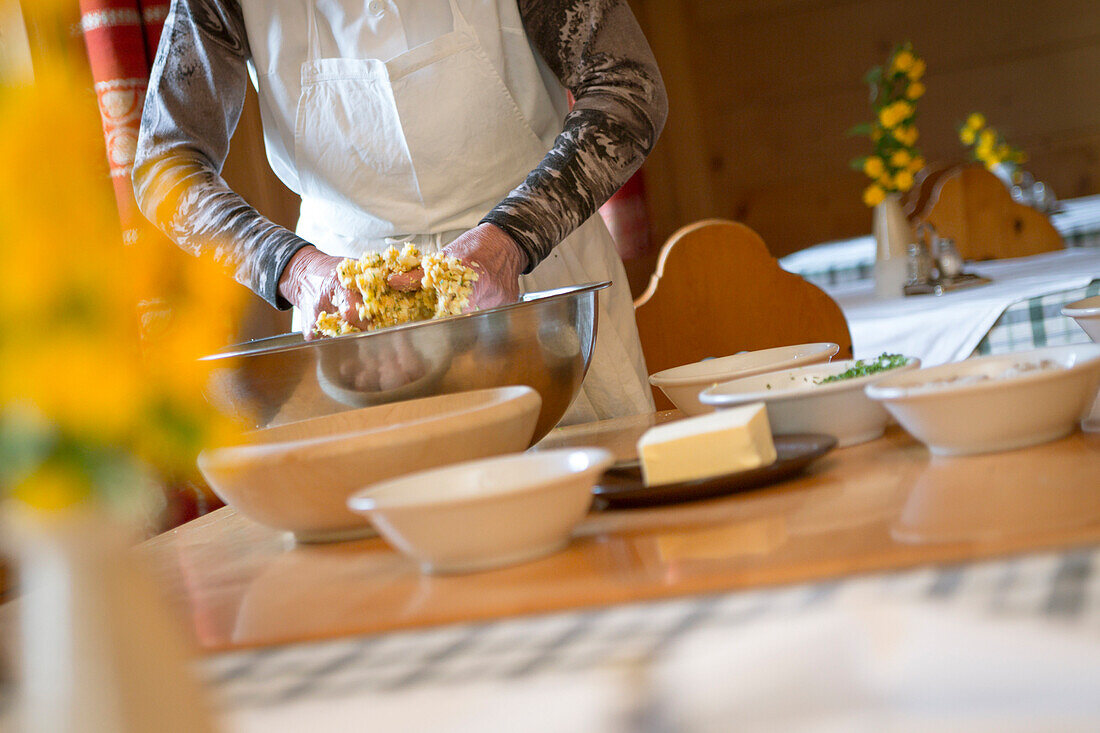 a Chef is mixing the ingredients to preparing the dumplings, Bolzano province, South Tyrol, Trentino Alto Adige, Italy