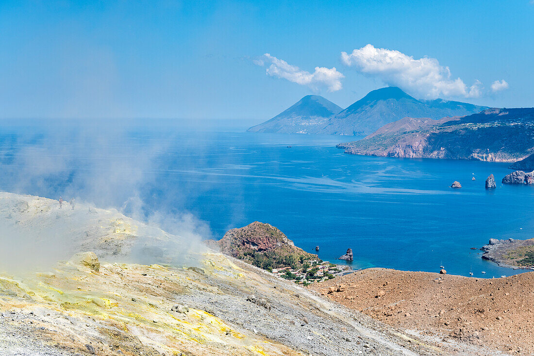 Volcano, Messina district, Sicily, Italy, Europe, Sulfur fumaroles on the crater rim of Vulcano, In the background the islands of Lipari and Salina