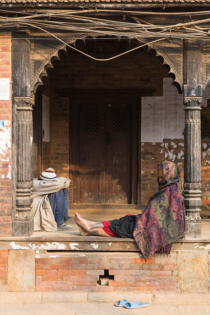 Bhaktapur, Kathmandu, Bagmati area, Nepal People sleeping on a ledge