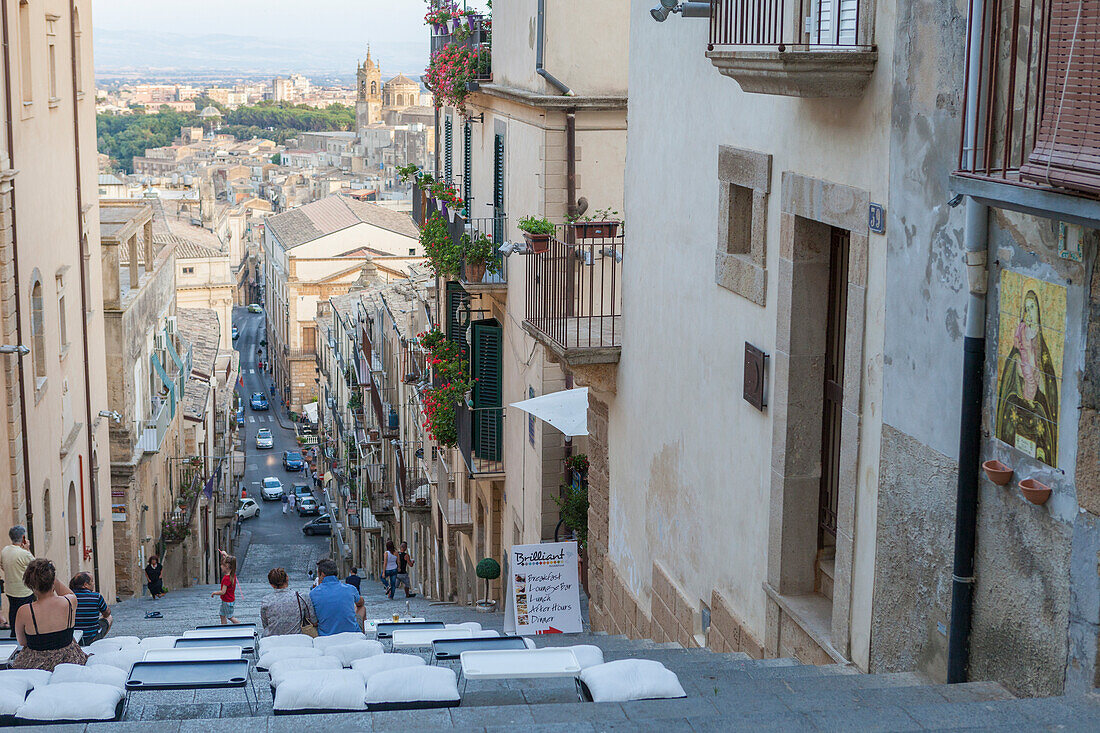 Tourists on flight of steps admire the old town and of Caltagirone province of Catania Sicily Italy Europe