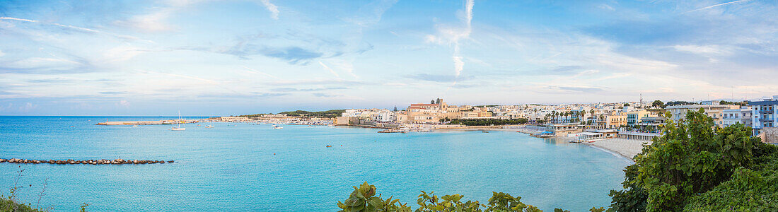 Turquoise sea frames the beach and the medieval old town Otranto province of Lecce Apulia Italy Europe