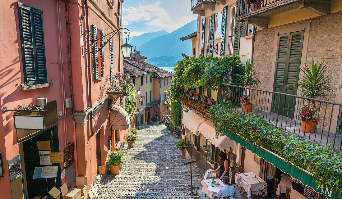 Shops on Salita Serbelloni in the historic old town with the lake in the distance, Bellagio, Lake Como, Lombardy, Italian Lakes, Italy, Europe