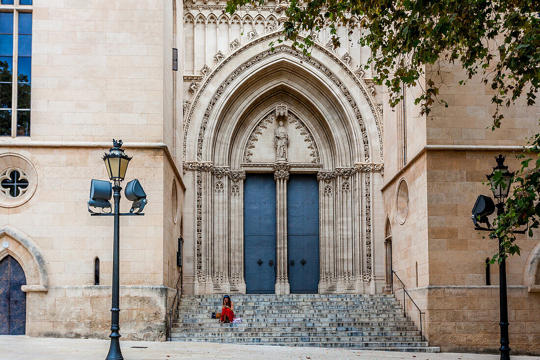 Girl in red skirt, stairs of Iglesia Santa Eulalia, historic city centre, Ciutat Antiga, Palma de Mallorca, Majorca, Balearic Islands, Mediterranean Sea, Spain, Europe