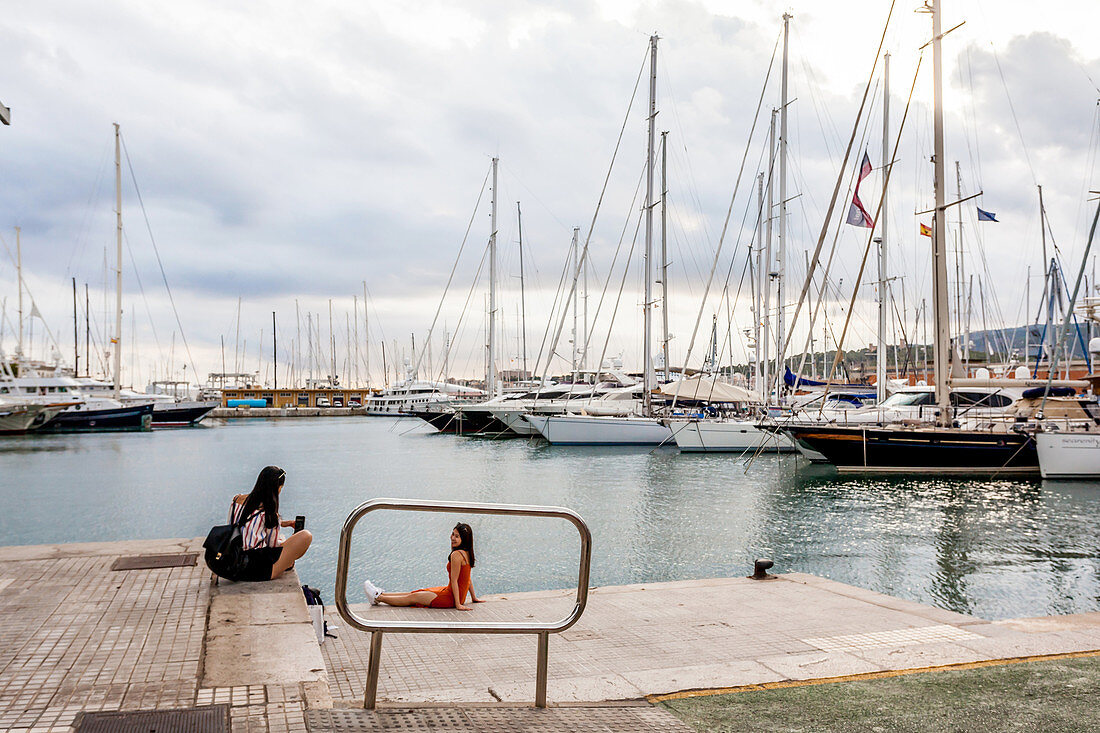 Tourists taking pictures with luxury yachts at the port of Mallorca. Puerto de Palma, Port of Palma, Palma, Mallorca, Spain, Europe