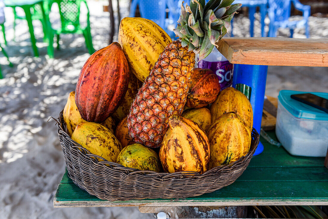 Tropical fruit basket on beach in south Bahia, Ilha de Boipeba, Brazil