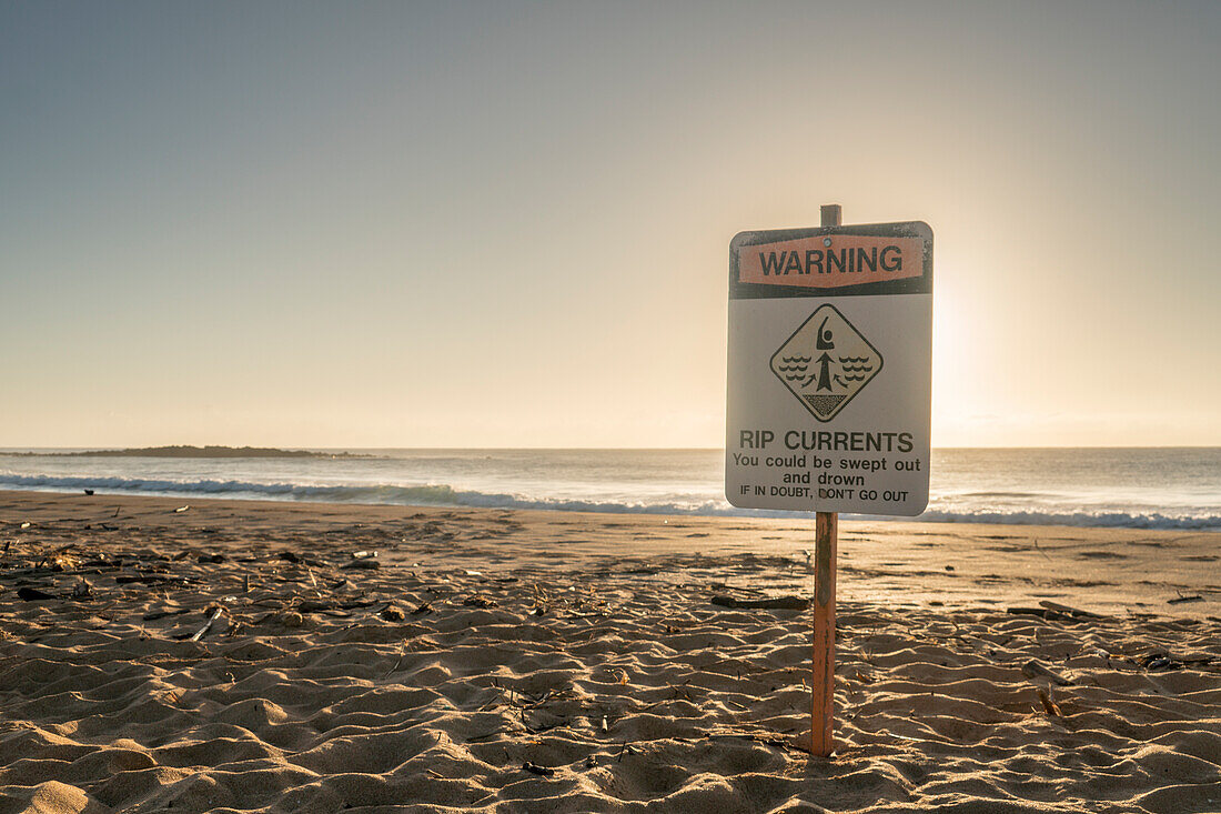 A warning sign on a beach in Kauai, Hawaii