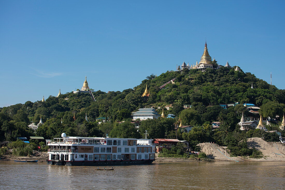 Ayeyarwady (Irrawaddy) river cruise ship The Strand (The Strand Cruise) and pagodas on Sagaing Hill, Sagaing, Sagaing, Myanmar