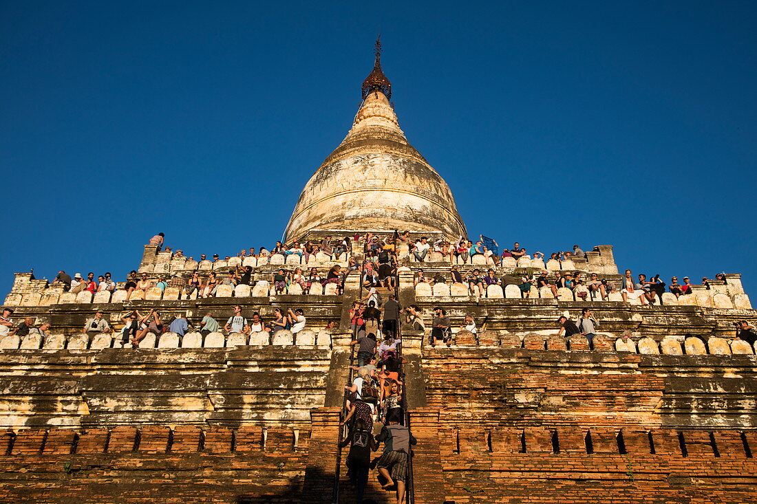 People crowd terraces of Shwesandaw Pagoda to watch the sunset, Bagan, Mandalay, Myanmar