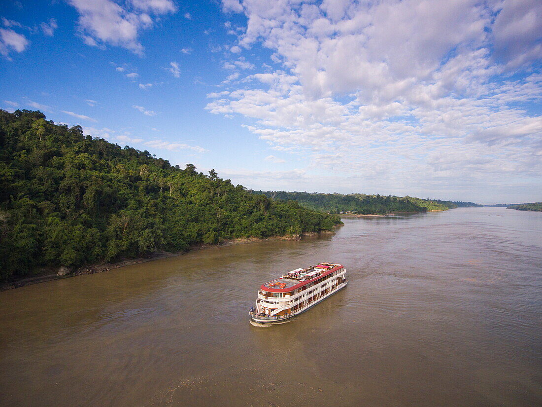 Aerial of Ayeyarwady (Irrawaddy) river cruise ship Anawrahta (Heritage Line) in narrow gorge, near Shwegu, Kachin, Myanmar